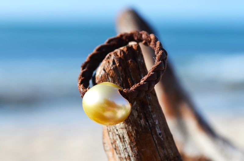 Bague tressée 1 perle d’Australie dorée - 12mm