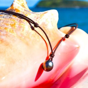 Adjustable brown cord pendant necklace with a 10.5 mm Tahitian cultured pearl displayed on a seashell