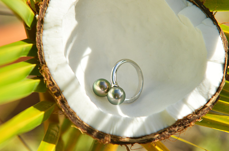 Sterling silver Toi et Moi ring with two Tahitian pearls displayed on mother-of-pearl