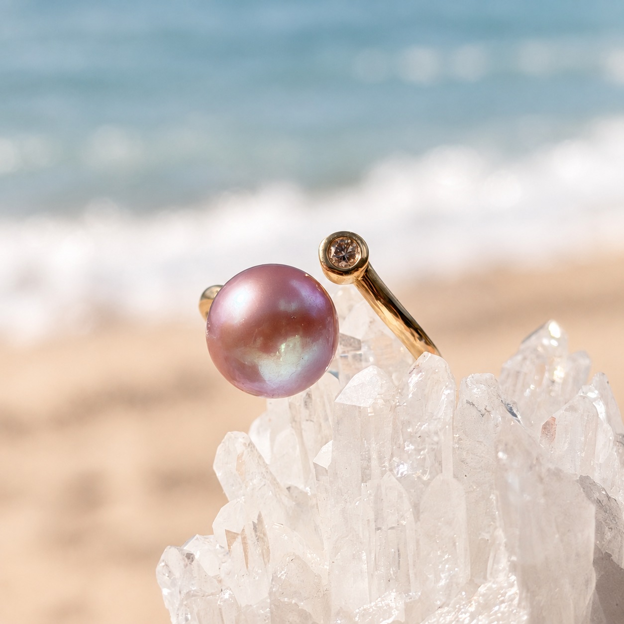 Precious gold ring with a pink pearl and diamond, on a crystalline display, side view.