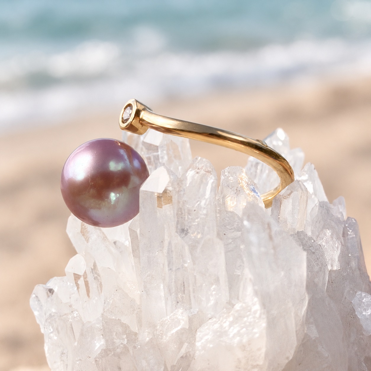 Precious gold ring with a pink pearl and diamond, on a crystalline display, back view.