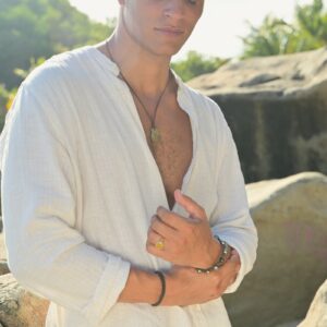 Leather pendant necklace with a four-reales coin, worn view.