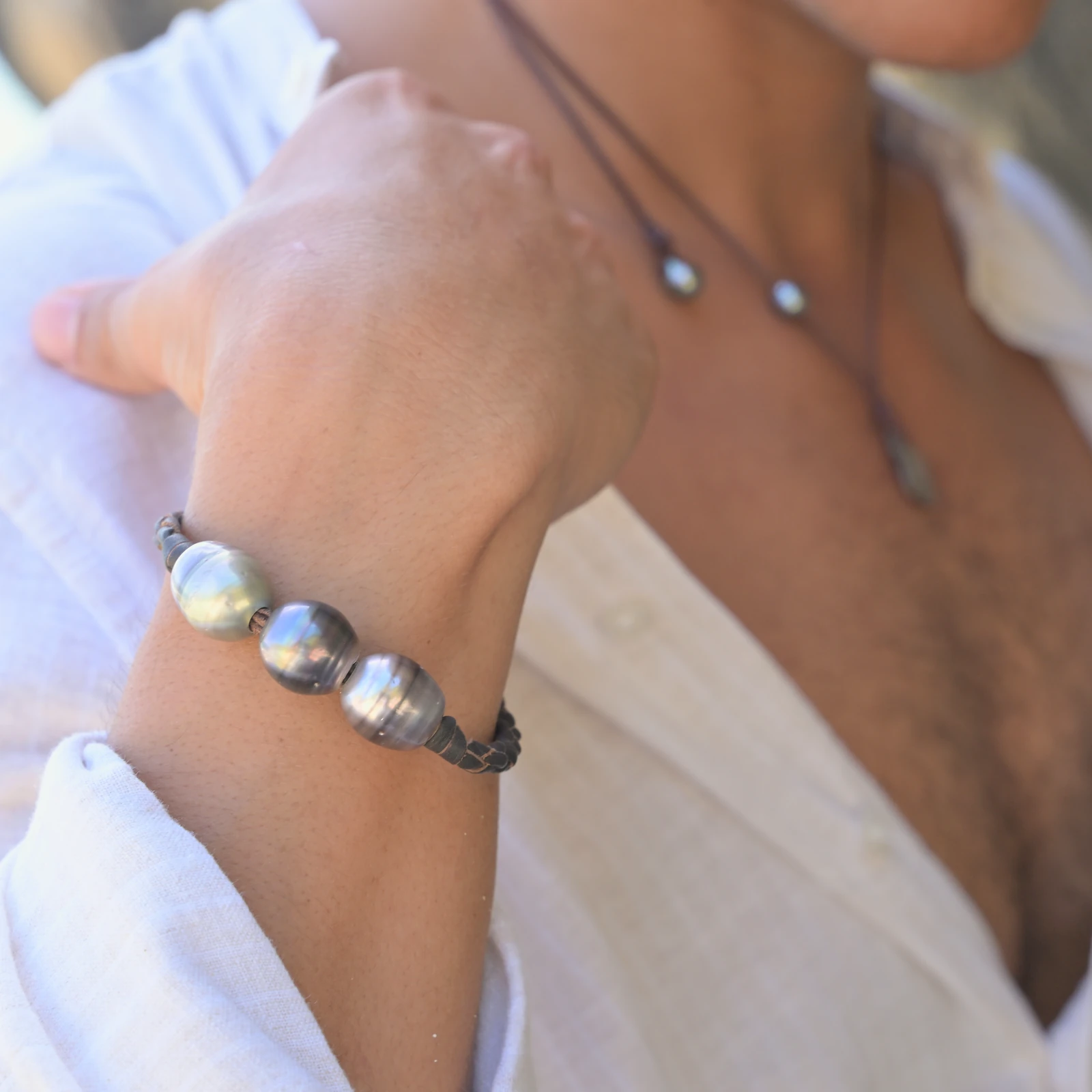 Men’s Leather Bracelet with Three Tahitian Pearls and a Choice of Construction, worn on the wrist.