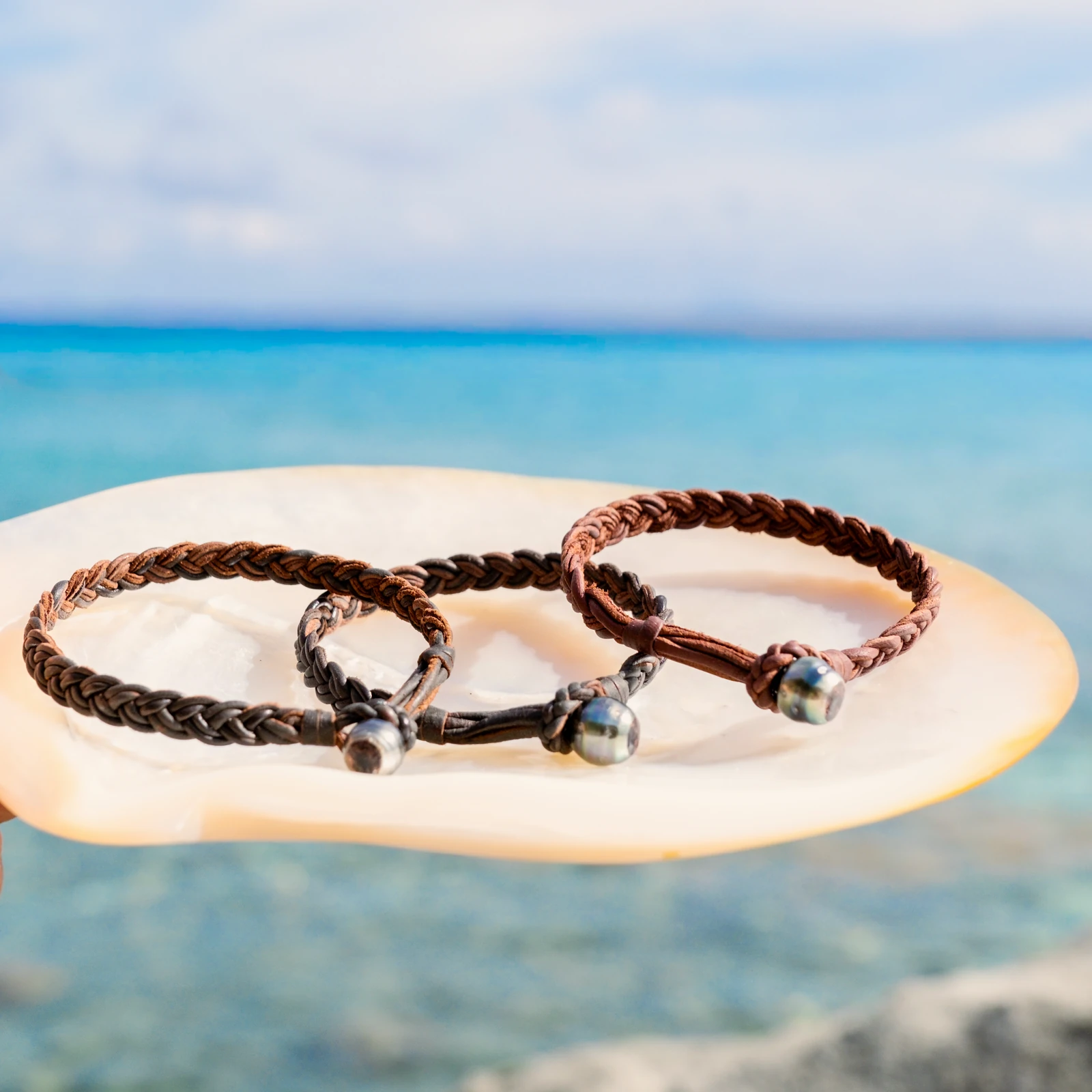 Braided Leather Bracelet with a Tahitian Pearl Clasp, jewelry view.