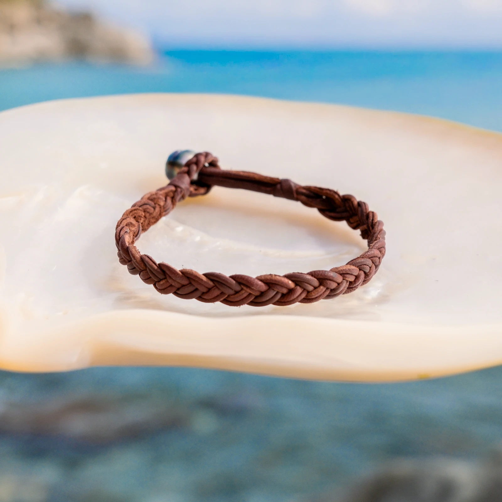 Braided Leather Bracelet with a Tahitian Pearl Clasp, jewelry view.