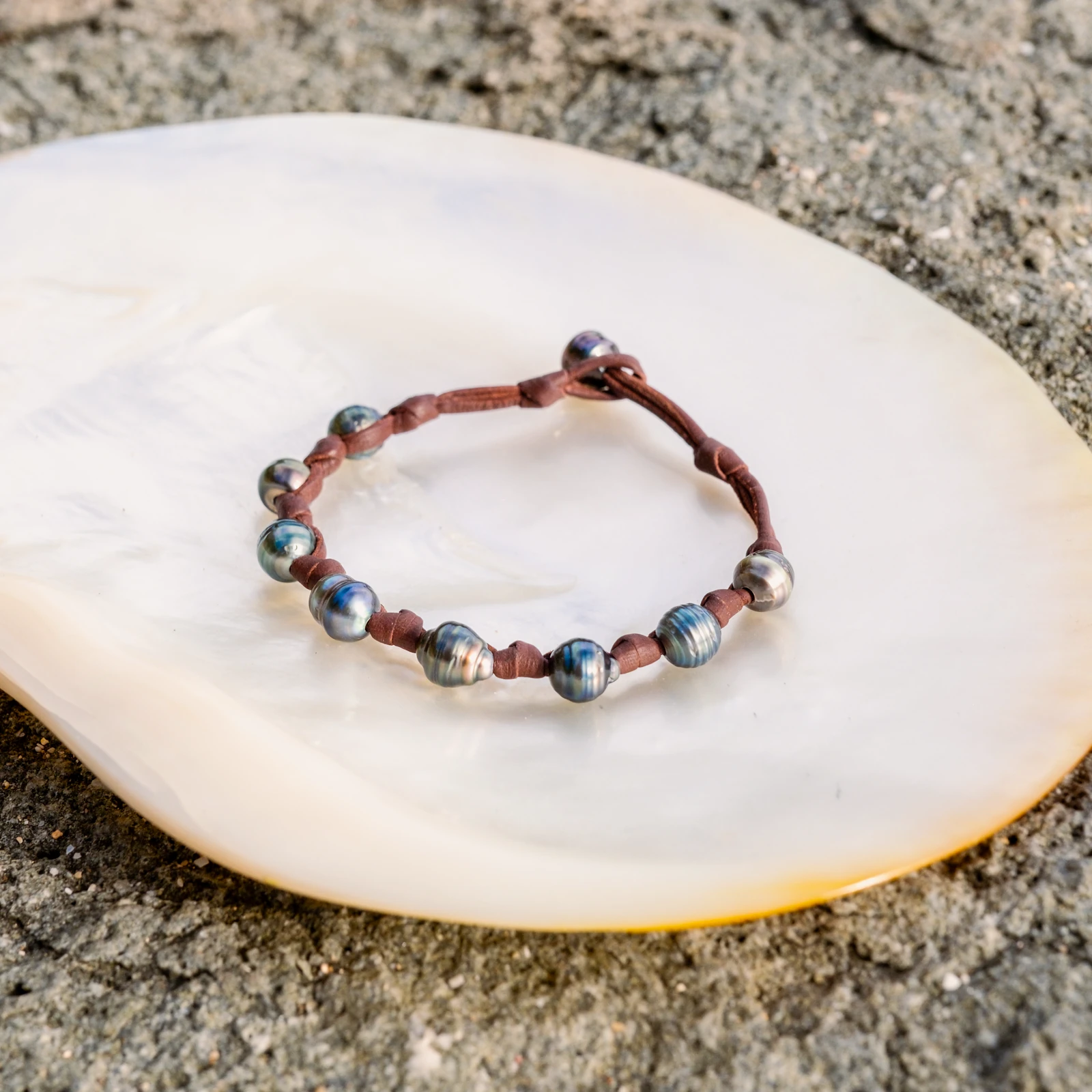Unisex Leather Bracelet with Tahitian Pearls and Knots, jewelry view.