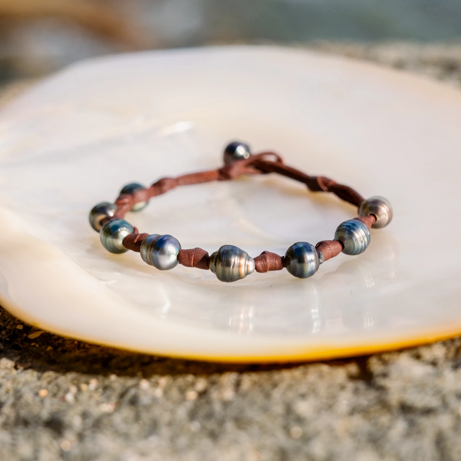 Unisex Leather Bracelet with Tahitian Pearls and Knots, jewelry view.