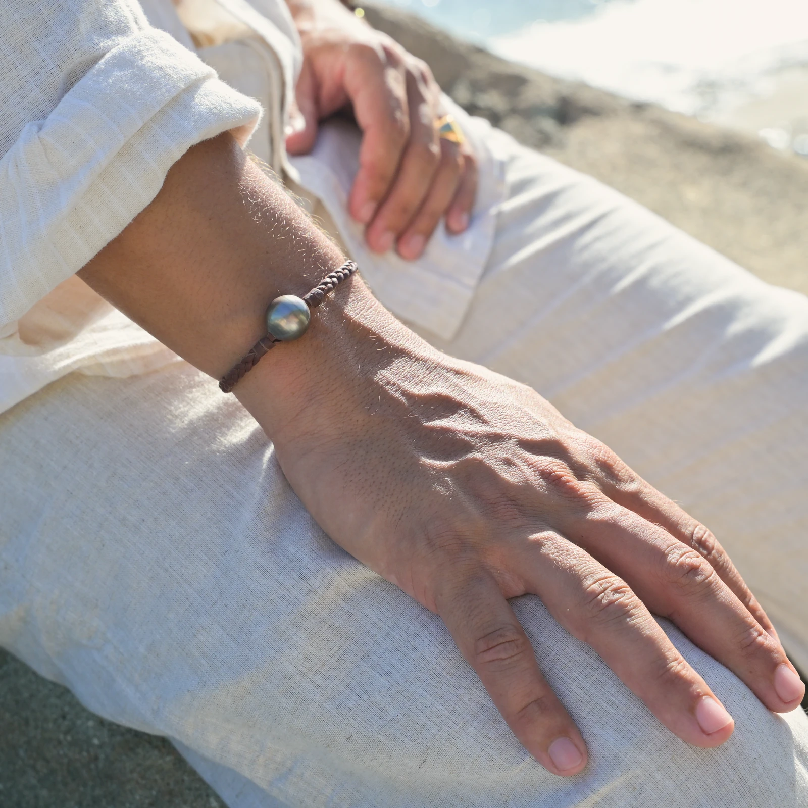 Leather Bracelet with Tahitian Pearls and a Choice of Construction, worn on the wrist.