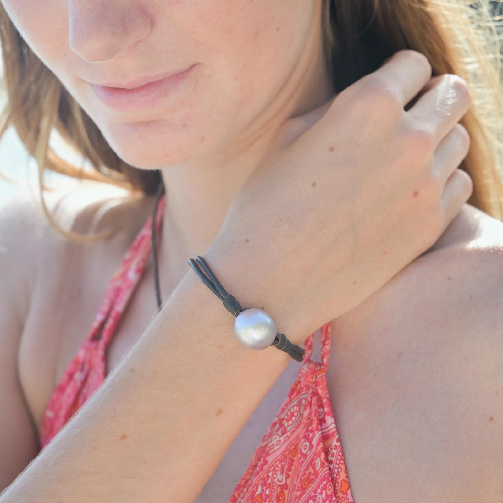 Leather Bracelet with Tahitian Pearls and a Choice of Construction, worn on the wrist.