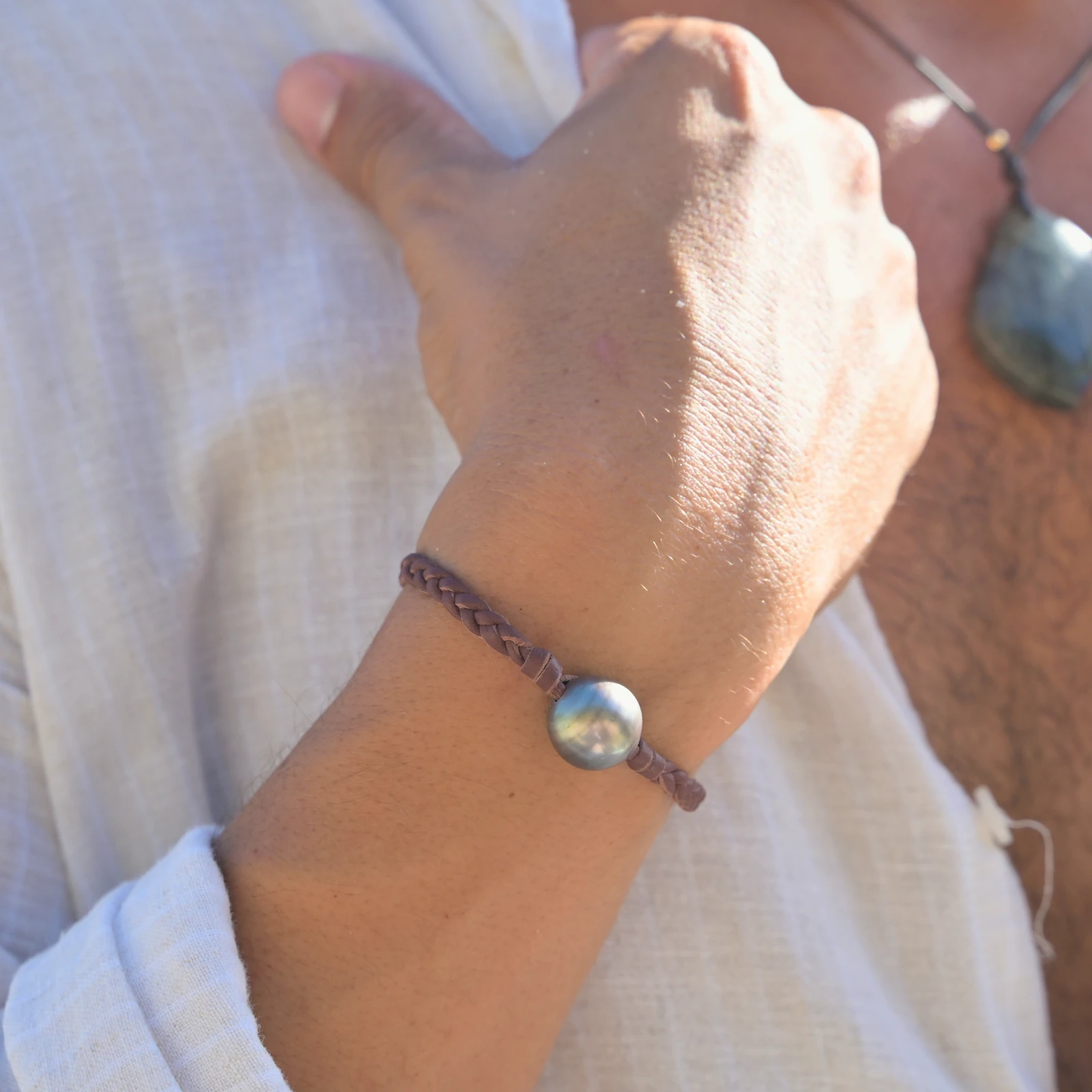 Leather Bracelet with Tahitian Pearls and a Choice of Construction, worn on the wrist.