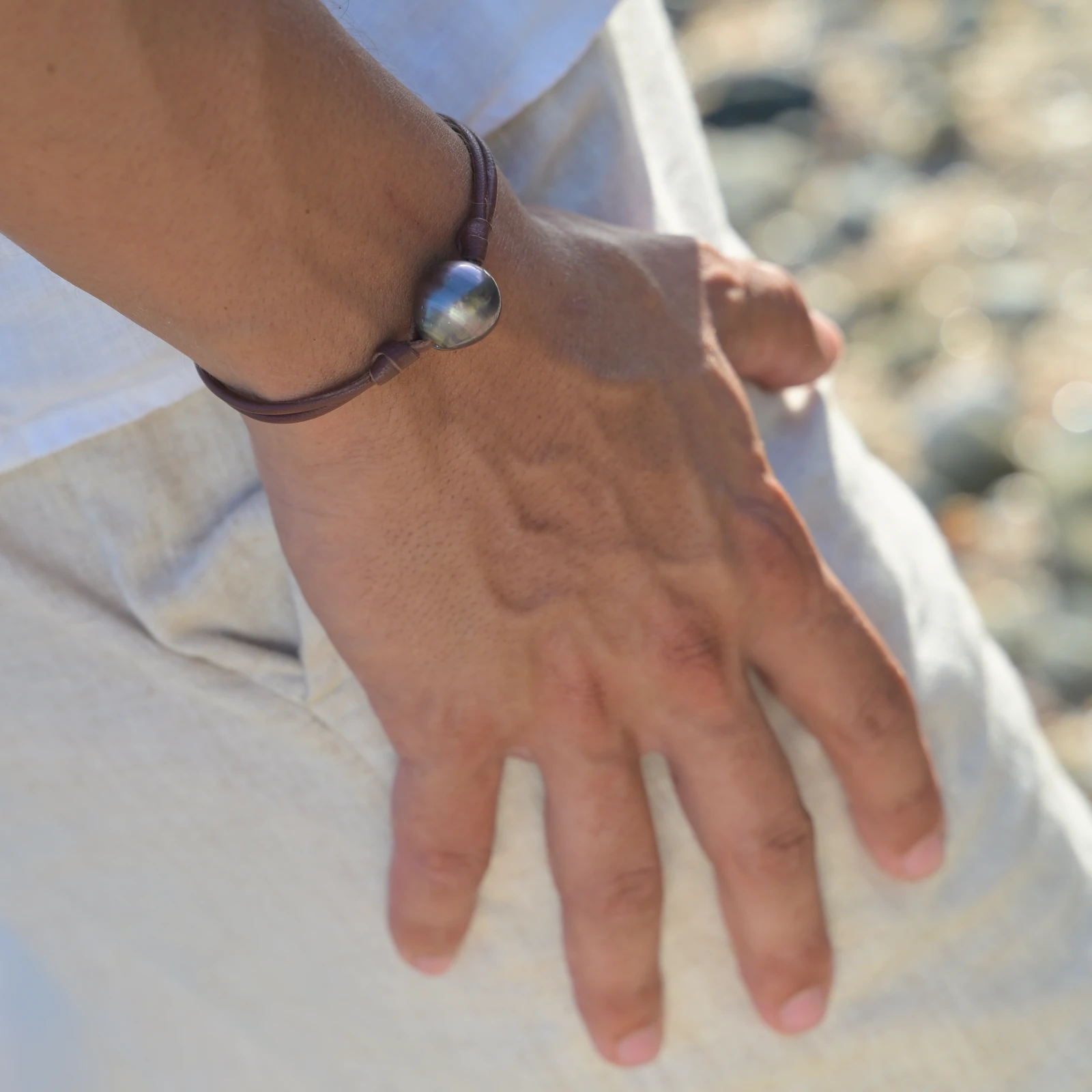 Leather Bracelet with Tahitian Pearls and a Choice of Construction, worn on the wrist.