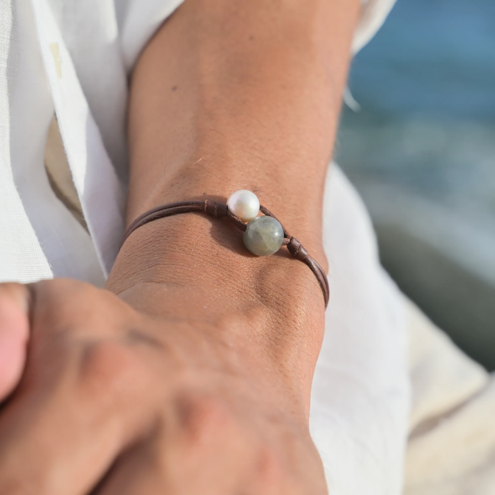 Two-Strand Bracelet with Labradorite and a Choice of Pearls, worn on the wrist.