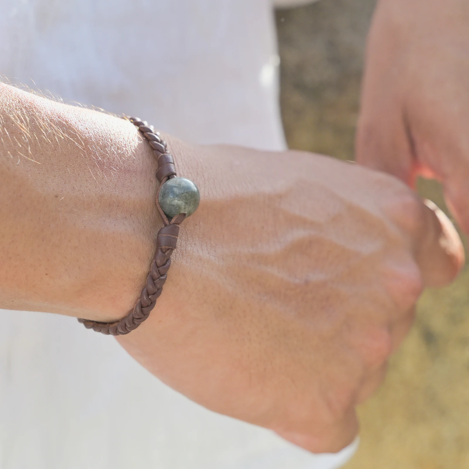 Leather Bracelet with Labradorite and a Choice of Clasp Pearl, worn on the wrist.