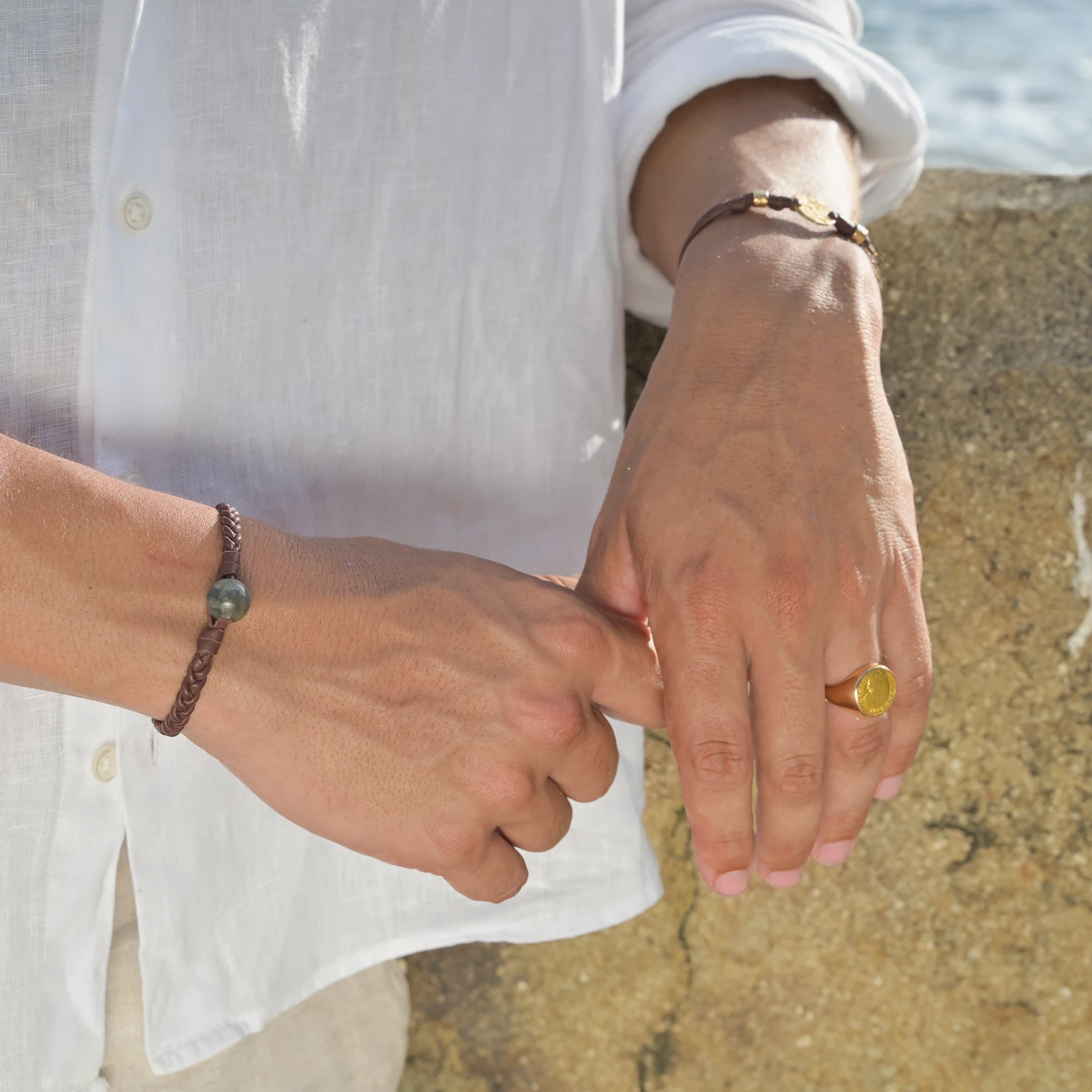 Leather Bracelet with Labradorite and a Choice of Clasp Pearl, worn on the wrist.