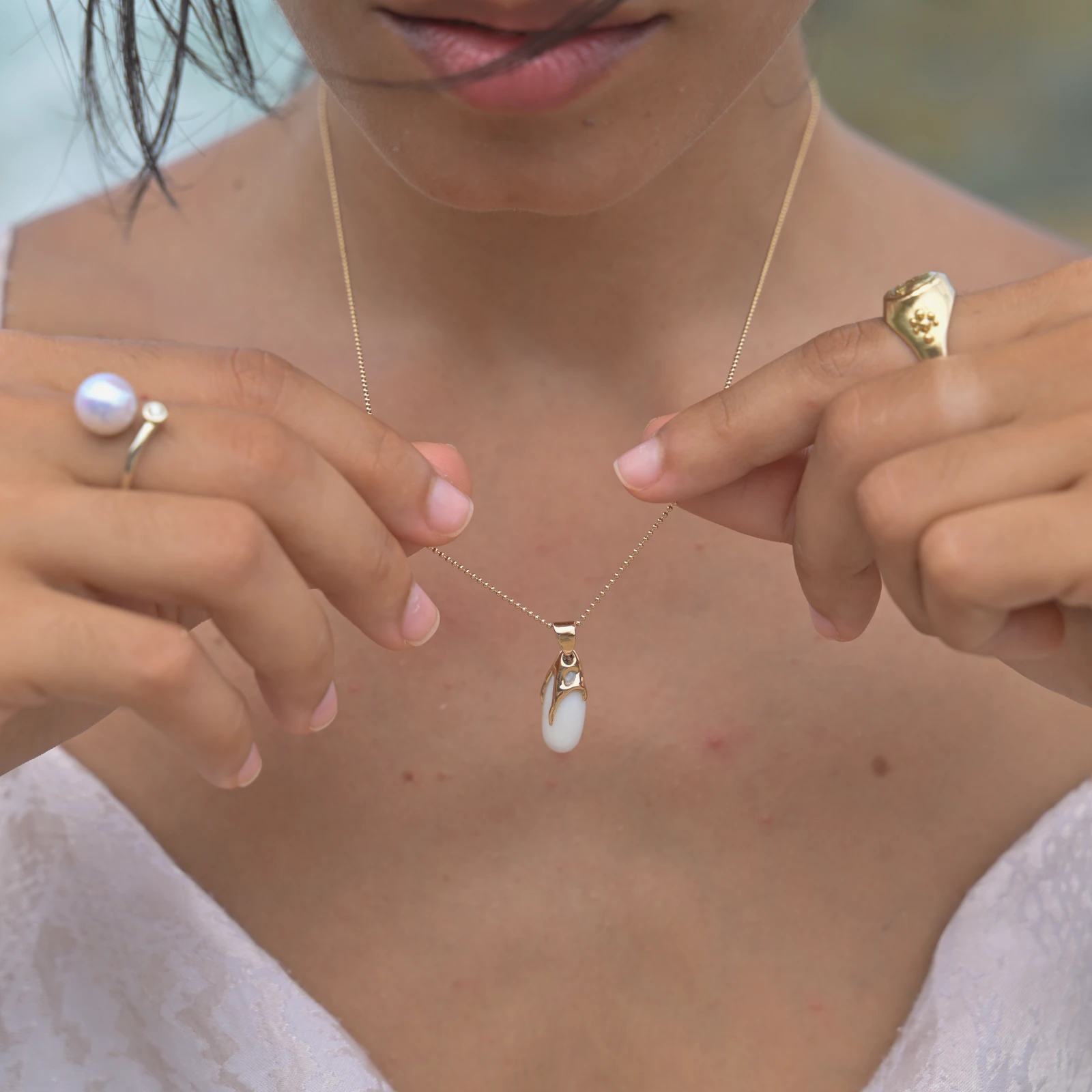 Toi et Moi white gold ring with a diamond and white pearl, worn on the hand