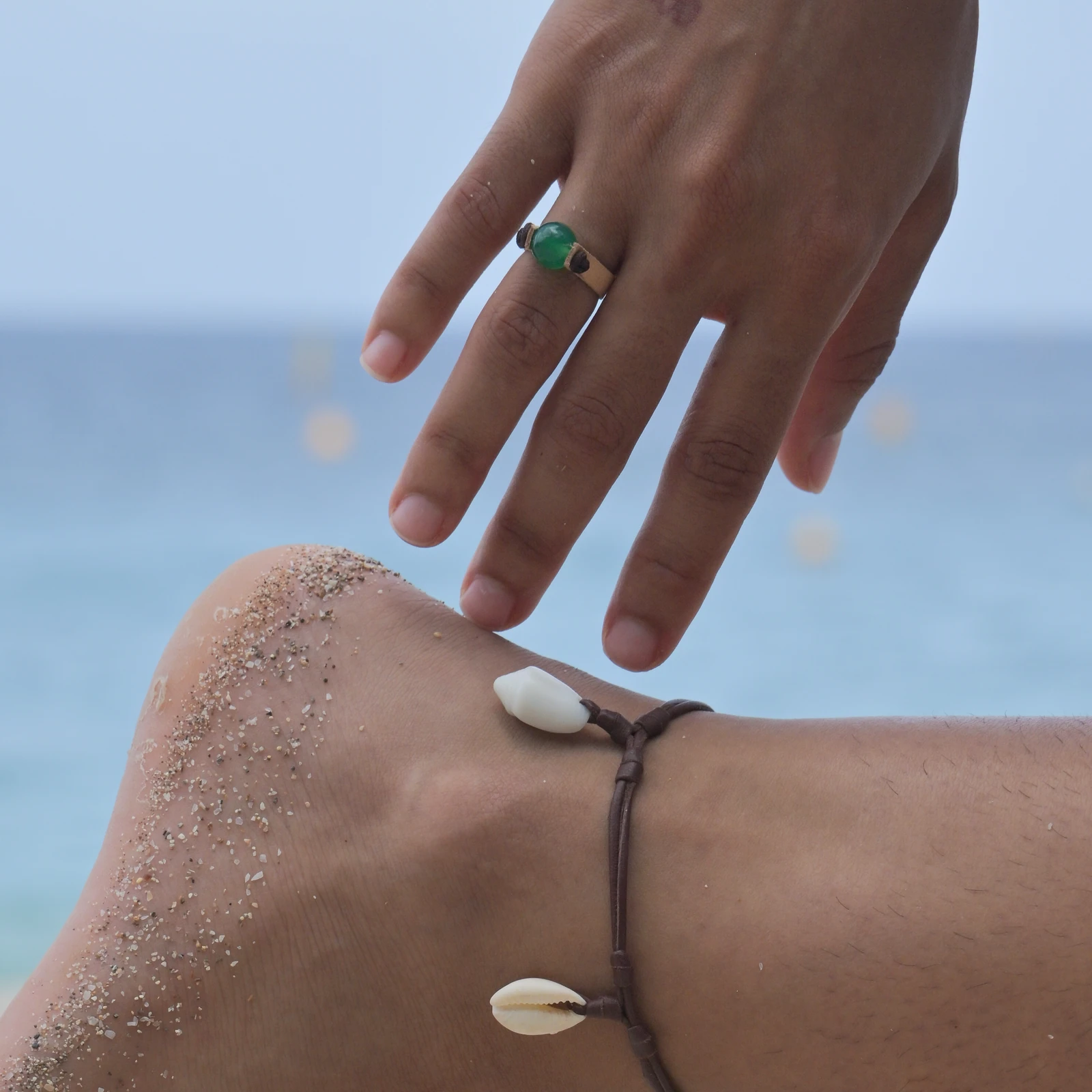 Flat leather ring with green jade, worn on the hand