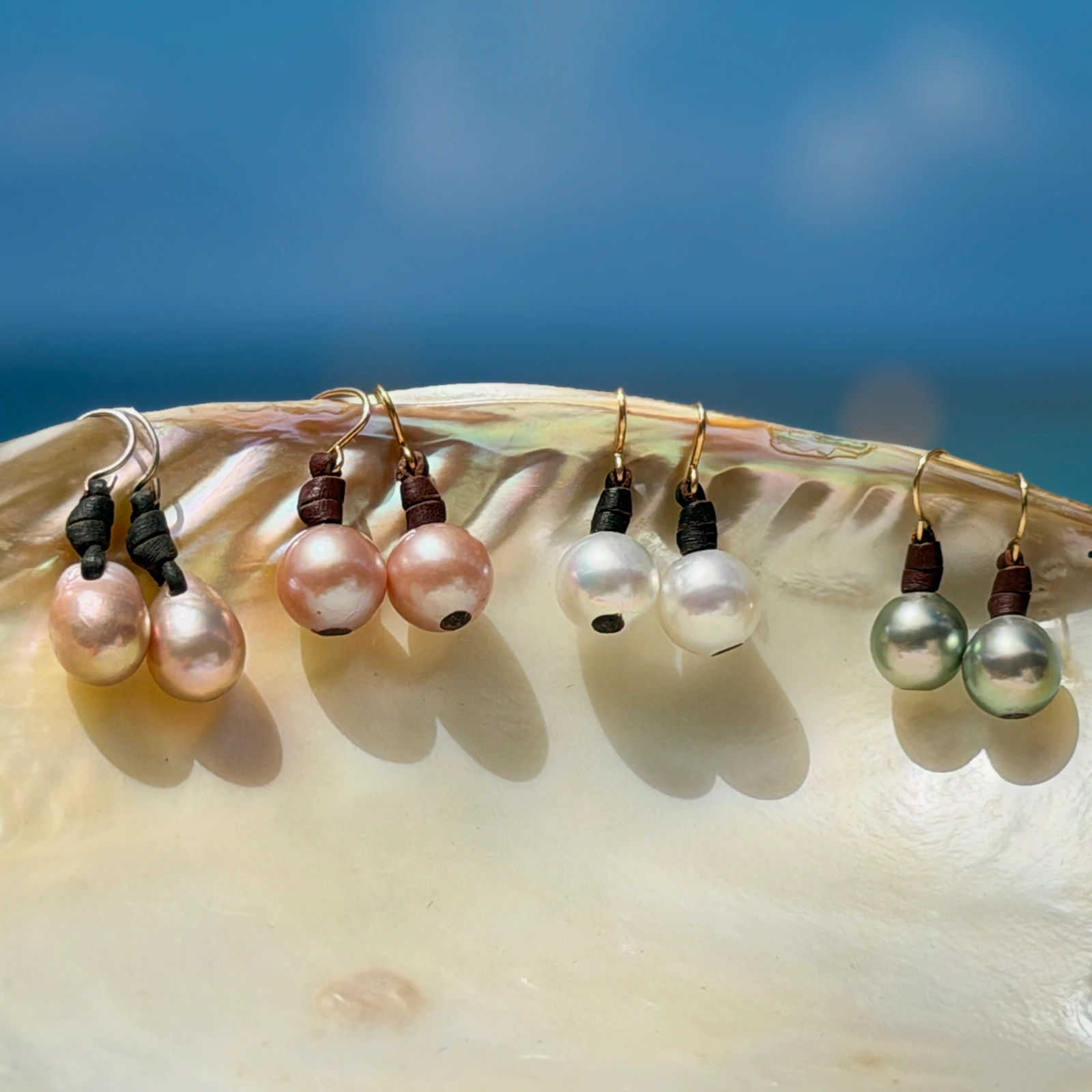 Classic leather earrings with cultured pearls, jewelry presentation