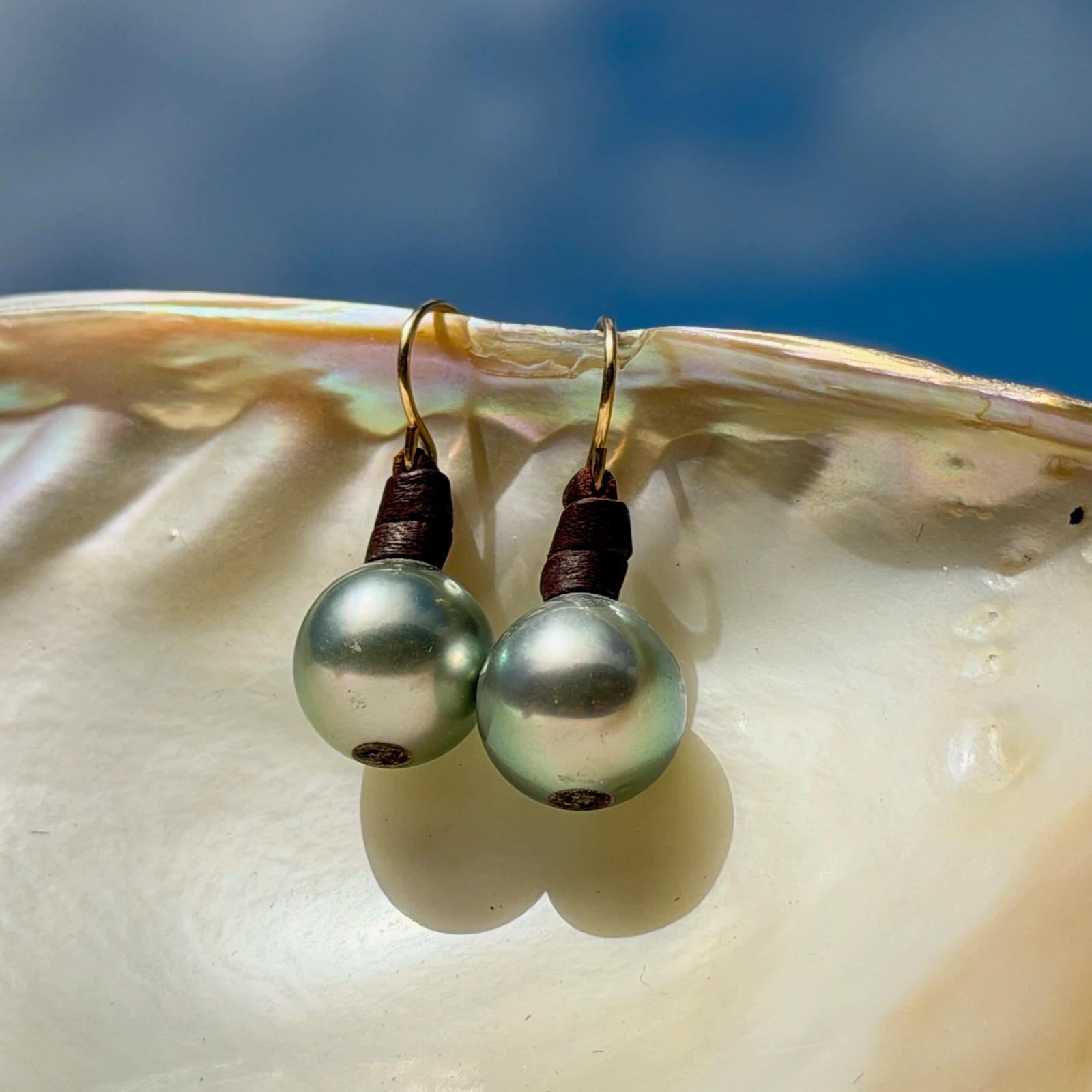 Classic leather earrings with cultured pearls, jewelry presentation