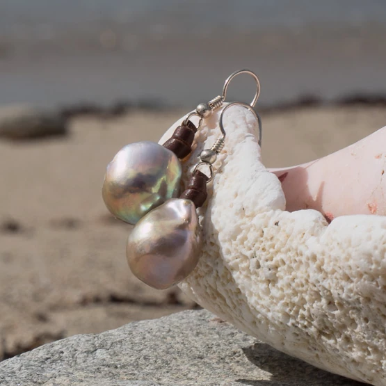 Leather earrings with large pink freshwater pearls, jewelry presentation