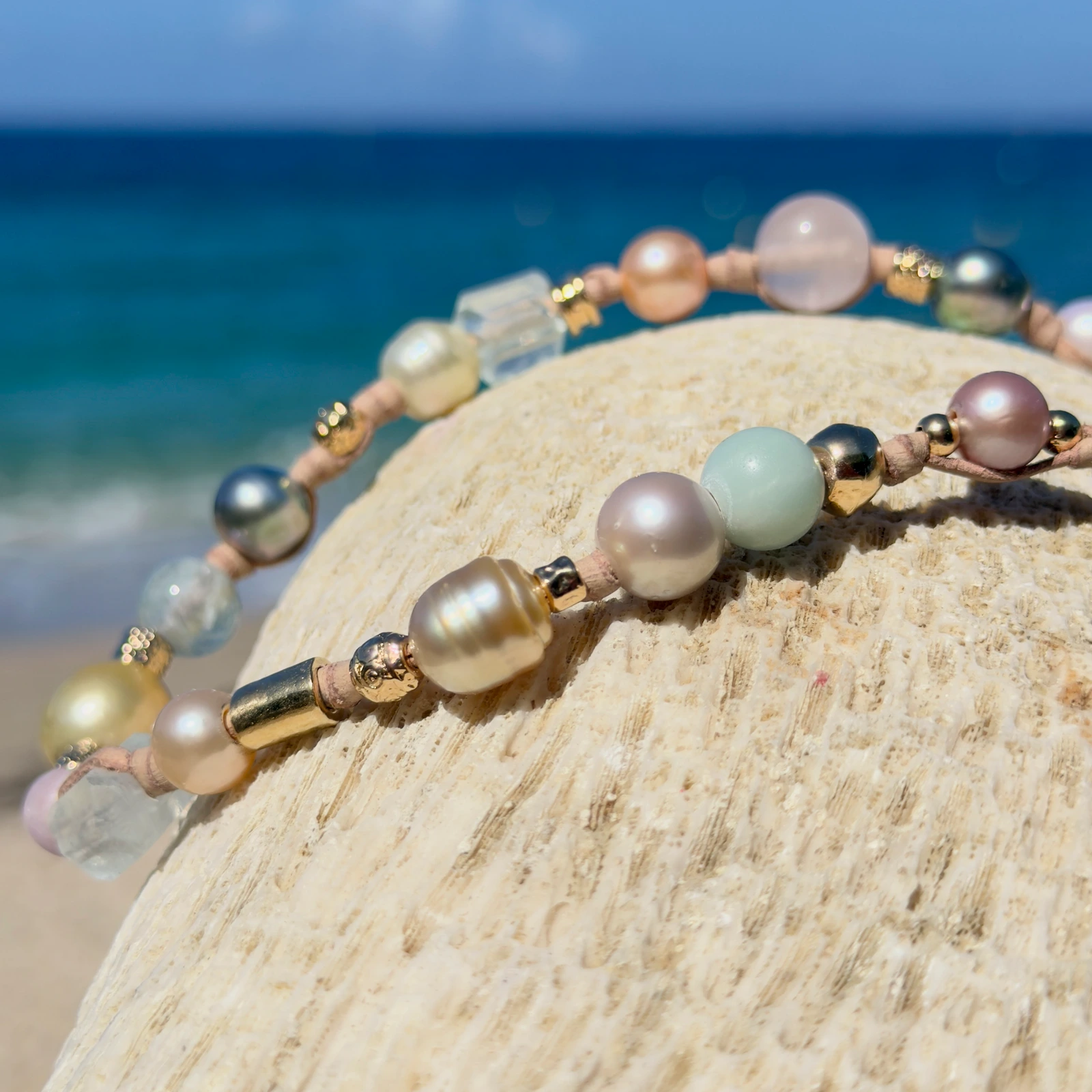 Light multicolored pearl and gemstone choker, still-life view