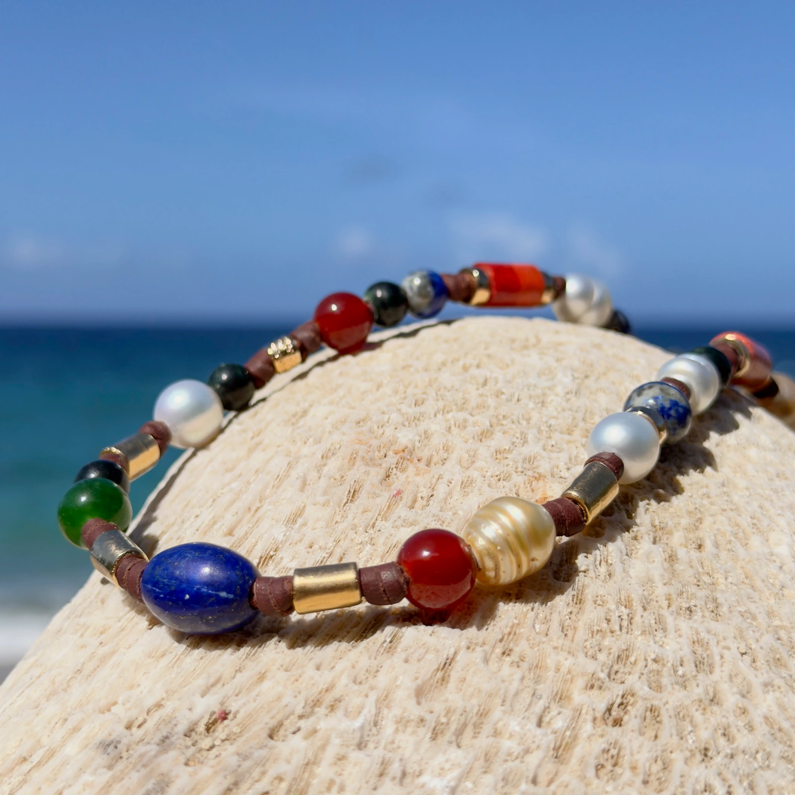Dark multicolored pearl and gemstone choker, still-life view