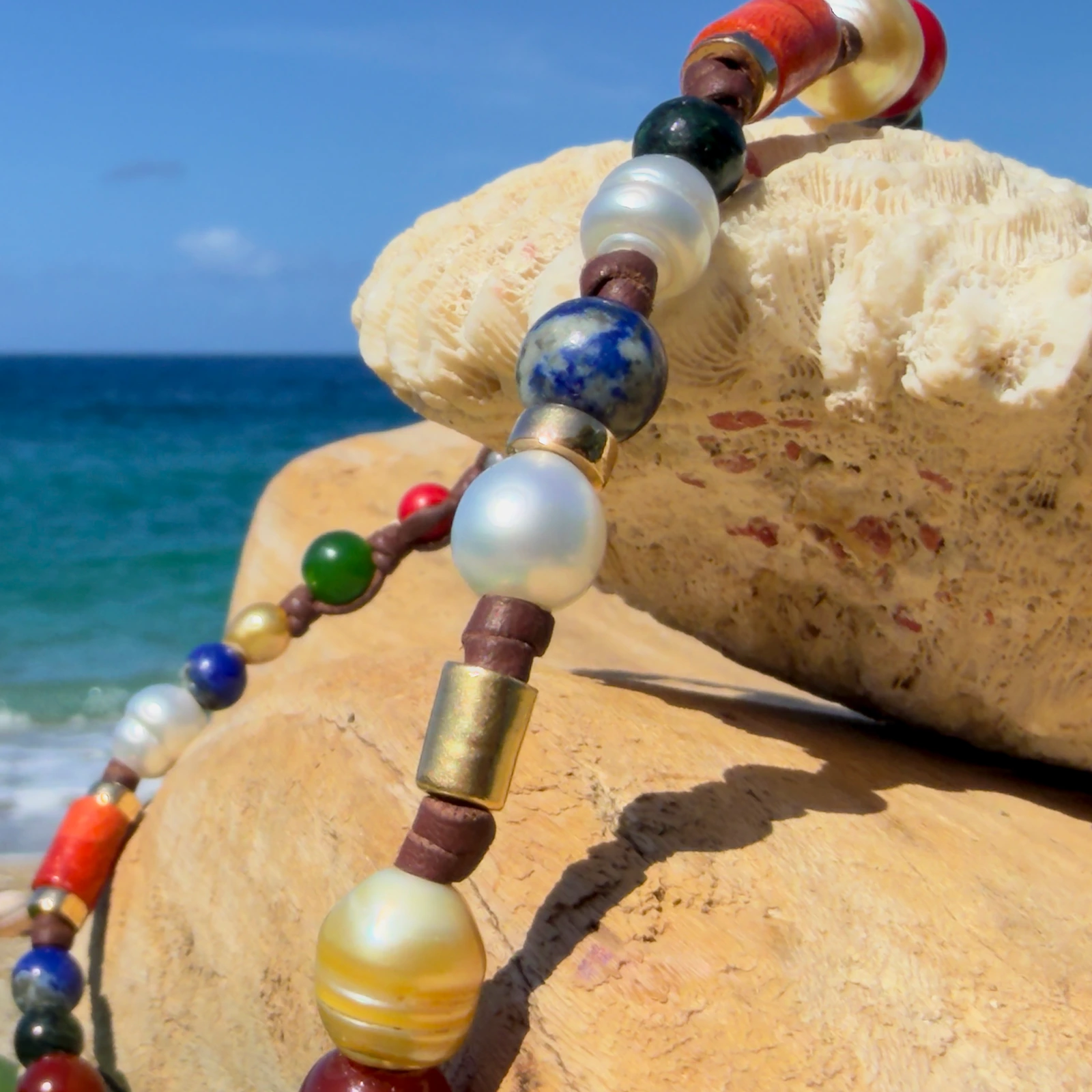 Dark multicolored pearl and gemstone choker, still-life view