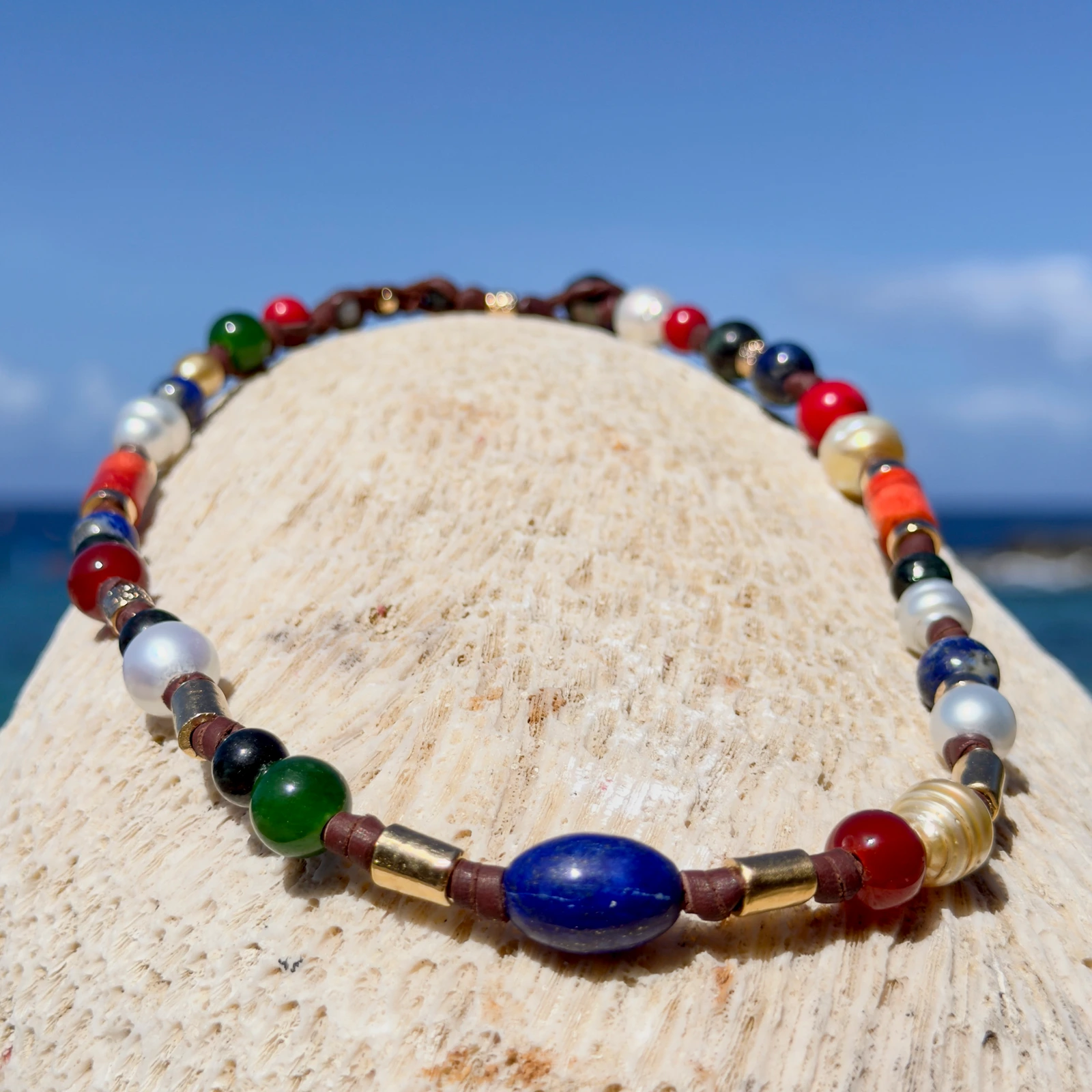 Dark multicolored pearl and gemstone choker, still-life view