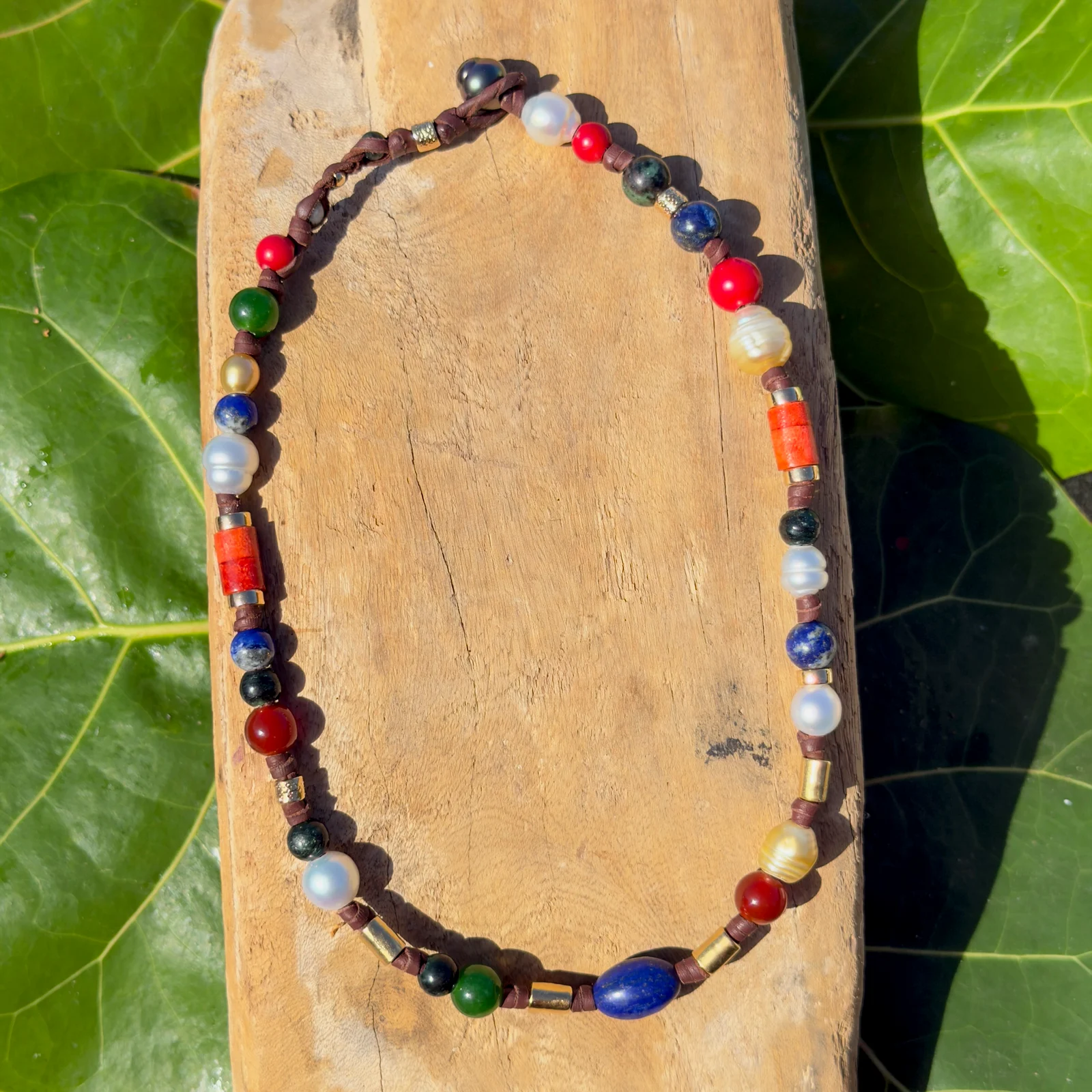 Dark multicolored pearl and gemstone choker, still-life view