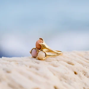 Bouquet ring in 18K gold with three natural conch pearls, still-life view