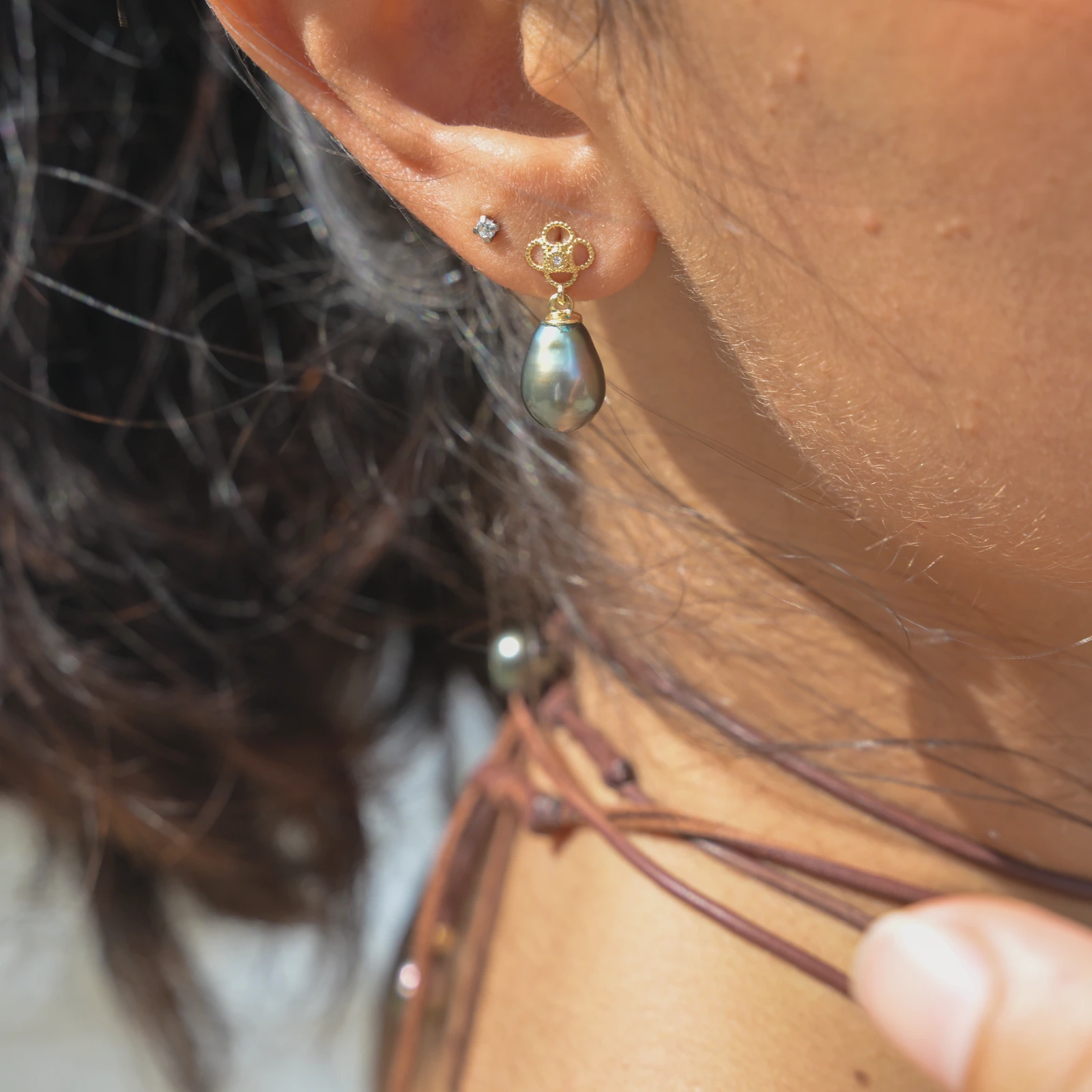 Gold Flower earrings with diamonds and a choice of pearls, worn