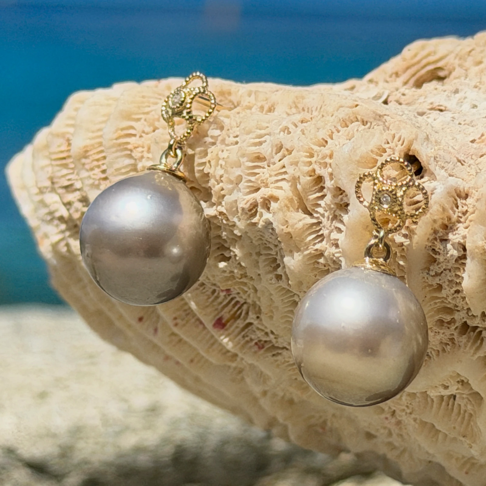 Gold Flower earrings with diamonds and a choice of pearls, still-life view